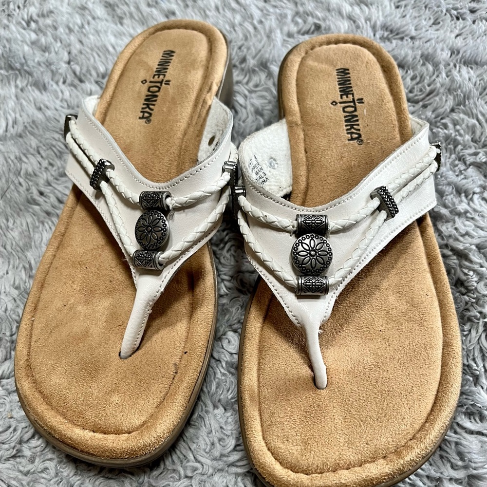 White Minnetonka sandals.